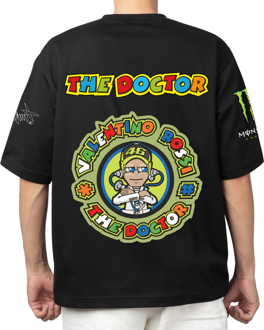 Back view of black oversized t-shirt featuring colorful Valentino Rossi ‘The Doctor’ cartoon artwork and branding.