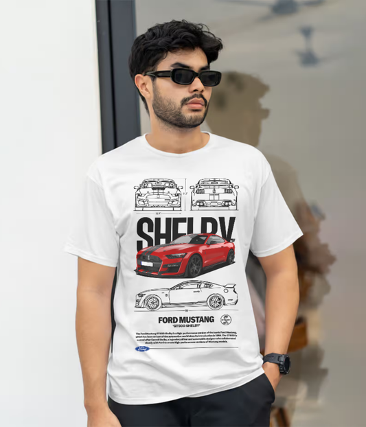 Man wearing a white Shelby Ford Mustang GT500 graphic T-shirt with red car illustration

Shelby Mustang GT500 automotive design T-shirt for car enthusiasts

White unisex Ford Mustang Shelby tee with racing car print